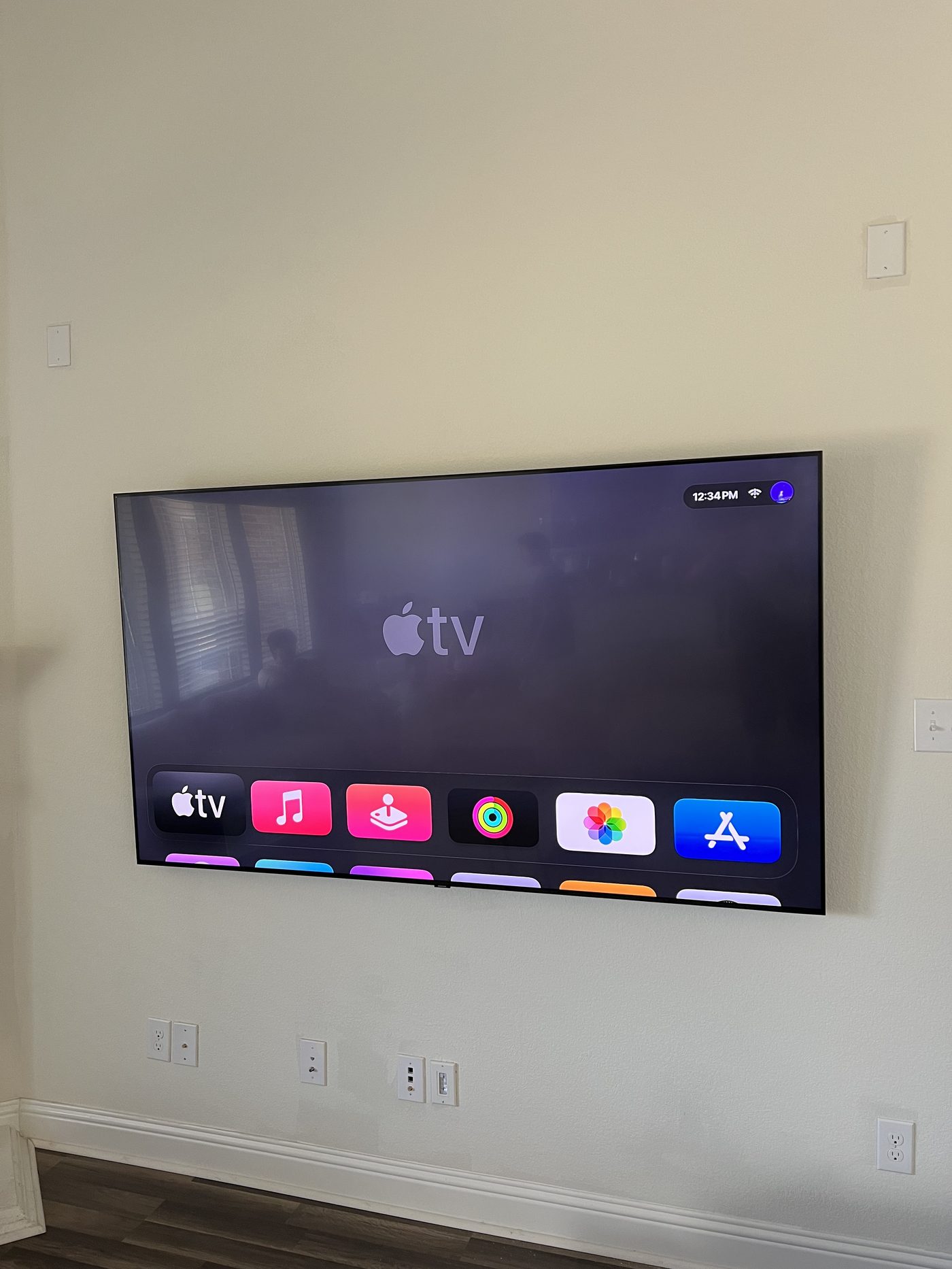 Apple TV setup clean flat wall mount no cords visible Dallas TX