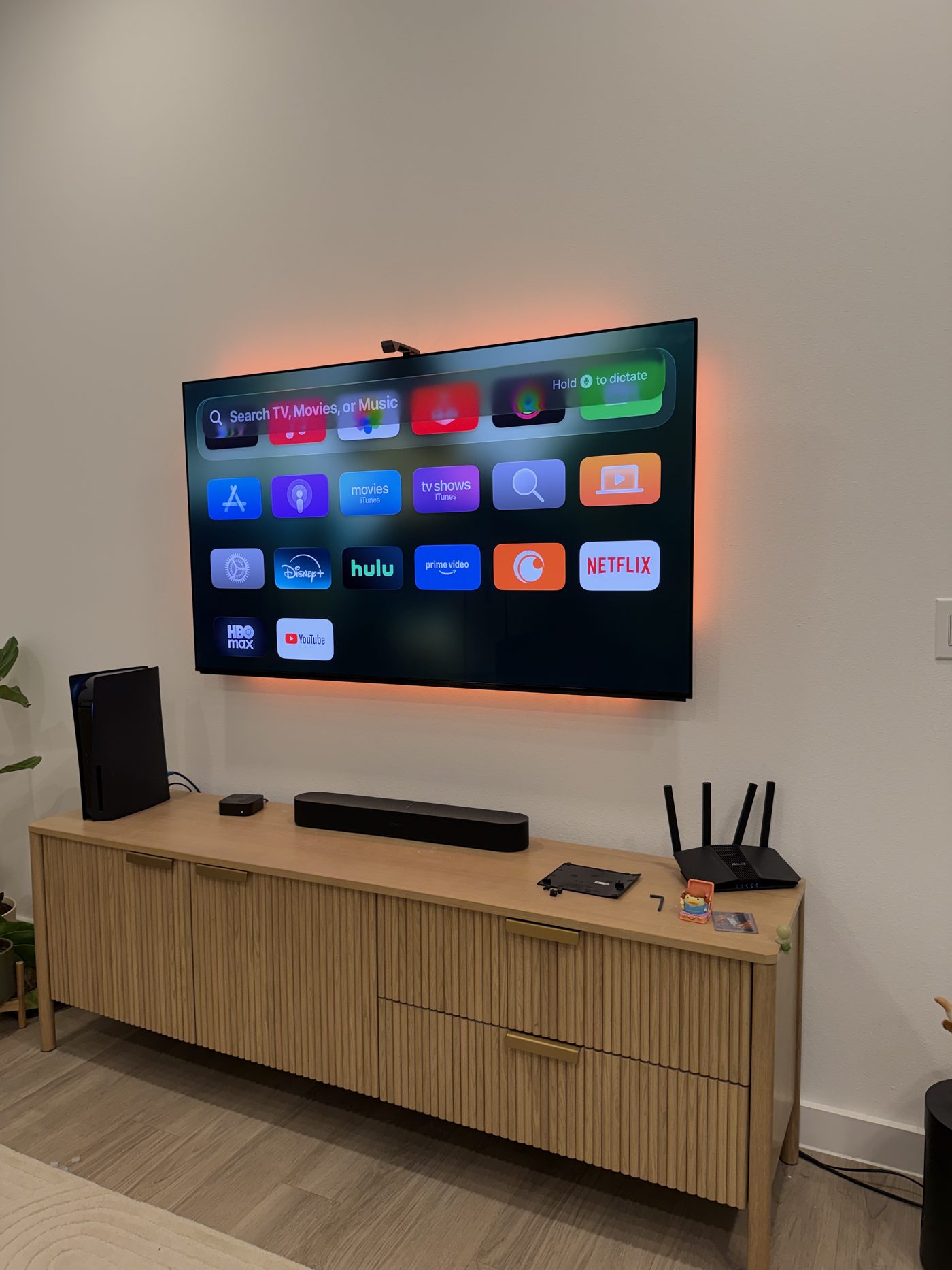 Large TV professionally wall mounted in living room Dallas TX by EZ TV Mounting