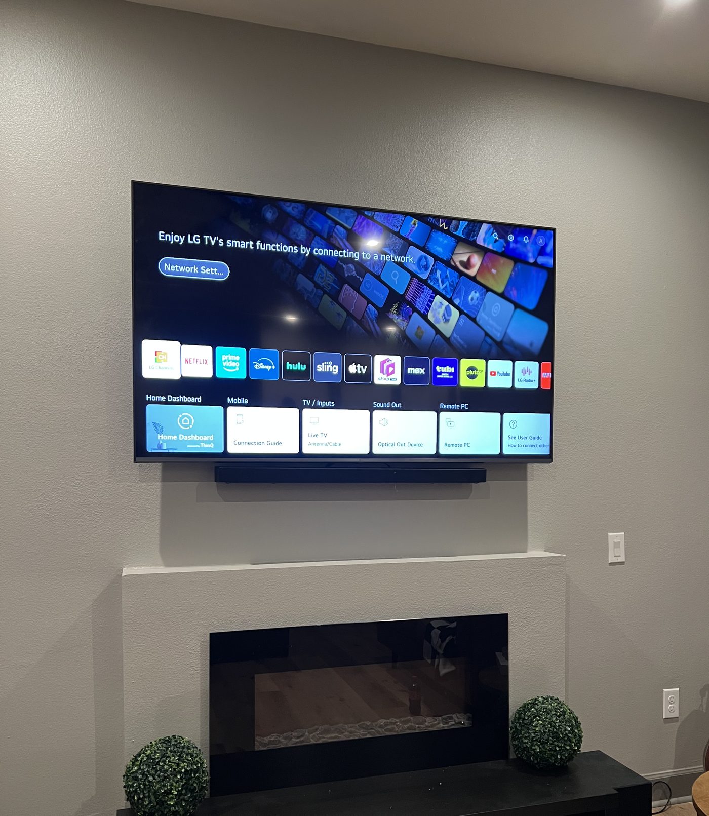 TV and soundbar above fireplace Plano TX - EZ TV Mounting